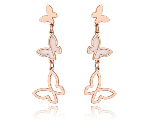 Elegant stainless steel earrings are made in a rose gold and silver colour. They consists of three connected butterflies. Butterflies are connected from the smallest one to the biggest. The smallest one has shiny rose gold surface, the middle one is adorned with white shell and the biggest one represents only butterfly silhouette. Earrings are rose gold plated and represent perfect and elegant touch to your evening outfit. They have stud fastening.