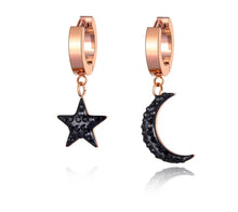 Load image into Gallery viewer, Beautiful stainless steel hoop earrings are made in a rose gold colour. They consists of a little hoop with two different charms: a moon and a star. Both charms are adorned with black cubic zirconia. Earrings are rose gold plated and represent perfect and elegant touch to your daily outfit. They have French lock (hoops).
