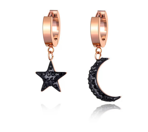 Beautiful stainless steel hoop earrings are made in a rose gold colour. They consists of a little hoop with two different charms: a moon and a star. Both charms are adorned with black cubic zirconia. Earrings are rose gold plated and represent perfect and elegant touch to your daily outfit. They have French lock (hoops).