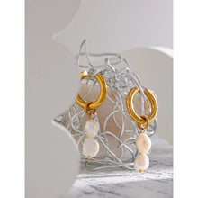 Load image into Gallery viewer, Elegant stainless steel earrings are made in a gold colour. They consists of small hoop on which two natural pearls are hanging. Combination of gold and pearls gives them extra elegant and classy effect. Earrings have real gold plating and represent great accessory to your elegant outfit. They have French lock (hoops).
