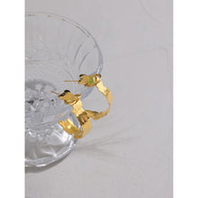 Load image into Gallery viewer, Elegant stainless steel earrings are made in a gold colour. They are in a shape of a hoop with irregular border, which gives them even classier look. Earrings have real gold plating and represent great accessory to your everyday outfit. They have stud fastening.
