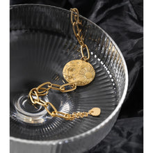 Load image into Gallery viewer, Bracelet is made of stainless steel and has real gold plating. Its link chain is adorned with medallion. Medallion has engraved sun, moon and little stars. The bracelet has adjustable length and lobster closer. It is perfect for everyday occasions. 
