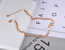 Load image into Gallery viewer, Bohemian stainless steel necklace is coming in rose gold colour and is three times gold plated. It is made of delicate and beautiful chain with links in a shape of leaves. In the bottom it is adorned with white artificial pearl. It makes great accessory for your daily and evening outfits.
