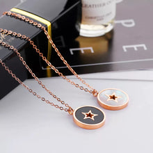 Load image into Gallery viewer, This beautiful necklace is made of stainless steel that is rose gold plated. It has link chain and pedant in a shape of a circle. Pedant is made of a shell and comes in two colours: white and black. The pedant is adorned with little star in rose gold colour. The necklace has adjustable length and lobster clasp.
