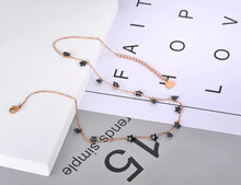 Load image into Gallery viewer, Stainless steel necklace comes in a rose gold and silver colour. it is three times gold plated. The necklace is made of fine thin chain which is adorned with fourteen little pedants in a shape of a star. Star pedants are made in black colour. This elegant bohemian necklace is perfect to spice up any outfit. It has lobster clasp.
