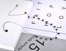 Load image into Gallery viewer, Stainless steel necklace comes in a rose gold and silver colour. it is three times gold plated. The necklace is made of fine thin chain which is adorned with fourteen little pedants in a shape of a star. Star pedants are made in black colour. This elegant bohemian necklace is perfect to spice up any outfit. It has lobster clasp.
