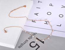 Load image into Gallery viewer, Stainless steel necklace comes in a rose gold and silver colour. it is three times gold plated. The necklace is made of fine thin chain which is adorned with fourteen little pedants in a shape of a star. Star pedants are made in black colour. This elegant bohemian necklace is perfect to spice up any outfit. It has lobster clasp and adjustable chain which is adorned with little pedant in a shape of a heart.
