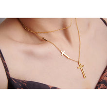 Load image into Gallery viewer, Stainless steel necklace comes in a gold colour and it is three times gold plated. This layered necklace is made of two different, thin and delicate chains with different length. Longer chain is adorned with three crosses in different sizes from which the biggest one is placed at the bottom of the necklace. The chain necklace is perfect for spicing up your daily and evening outfit. It has lobster clasp.
