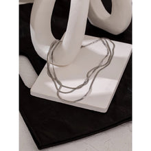 Load image into Gallery viewer, Stainless steel necklace with real gold plating comes in a gold and silver colour. It is made of a fine snake chain and it is made in three layers. Layers has different length. This snake chain necklace is perfect for glamming up your evening combination. It has lobster clasp.
