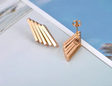 Load image into Gallery viewer, Stainless steel earrings are three times gold plated and come in a rose gold colour. Its rock design made them special for any outfit. They are made of five rectangles put together in a very interesting shape. Earrings have stud closure.
