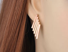 Load image into Gallery viewer, Stainless steel earrings are three times gold plated and come in a rose gold colour. Its rock design made them special for any outfit. They are made of five rectangles put together in a very interesting shape. Earrings have stud closure.
