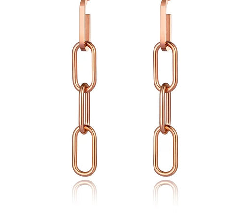 Rock glam earrings come in rose gold colour. They are made of stainless steel and additionally three times gold plated. They are made in a shape of a chain and can be worn as single chain link earring or with an option of earring with four links. They will be a perfect addition to your evening look. Stud closure.