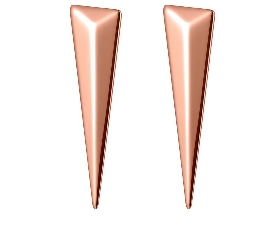 Rock glam earrings are made of stainless steel and come in two colours: rose gold and silver. Earrings are in a shape of a big triangle and has stud closure. They are perfect for spicing up your rock glam look.