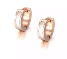 Load image into Gallery viewer, Little hoop earrings are made of stainless steel in a rose gold colour. They are adorned with line of black acryl or white shell. Earrings are three times rose gold plated and represent perfect and elegant touch to your day to day style. They have French closure.
