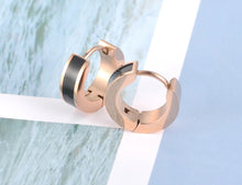 Load image into Gallery viewer, Little hoop earrings are made of stainless steel in a rose gold colour. They are adorned with line of black acryl or white shell. Earrings are three times rose gold plated and represent perfect and elegant touch to your day to day style. They have French closure.
