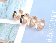 Load image into Gallery viewer, Little hoop earrings are made of stainless steel in a rose gold colour. They are adorned with line of black acryl or white shell. Earrings are three times rose gold plated and represent perfect and elegant touch to your day to day style. They have French closure.
