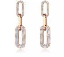 Load image into Gallery viewer, Very elegant and beautiful earrings have two colours variants: rose gold and silver. These statement earrings are consisting of three big chain links. The first and the last link are adorned with cubic zirconia which gives them classy and elegant look. Stud closure.
