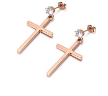 Load image into Gallery viewer, These elegant stainless steel earrings come in a rose gold colour. They are made in a shape of a simple cross which is adorned at its bottom with one sparkling cubic zirconia. Earrings are rose gold plated and represent perfect and elegant touch to your day to day style. They have stud fastening.
