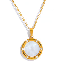 Load image into Gallery viewer, Stainless steel delicate necklace comes in a gold colour. It is made of fine and thin link chain and it has beautiful round pendant . Pendant is made of natural shell and it is circled with a fine golden border. It is also additionally adorned with small zircons which gives the necklace chic and stylish look. This necklace can be worn with any daily outfit. It has lobster clasp and adjustable length.
