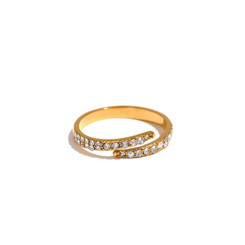 Stainless steel ring in gold colour is adorned with a line of cubic zirconia around its perimeter. The shape of the ring reminds on a snake with its open part at the top. The ring will give your hand a perfect elegance and style.