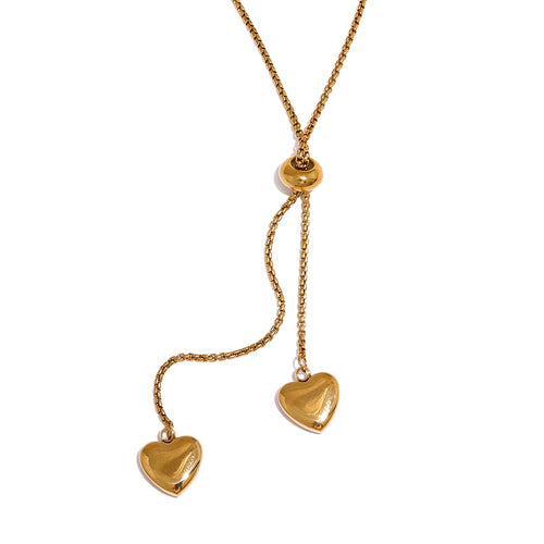 Stainless steel 18K gold plated necklace comes in a gold and silver colour. It is made of nice rounded chain and has a small ball as a decorative part and as well for length adjustment. There are two heart pendants at the ends of both chains that can be pulled up and down and has different lengths which makes this necklace very interesting. The  necklace is a great accessory for your evening outfit. 