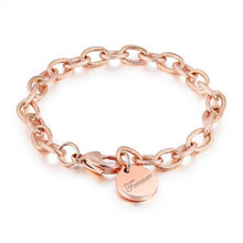 Load image into Gallery viewer, Beautiful stainless steel bracelet comes in two colours: rose gold and silver. It is made of rugged link chain which is adorned with circle charm and word: &#39;Forever&#39;. The bracelet has adjustable length and lobster clasp. Its simplicity makes it perfect accessories to any outfit. 
