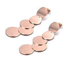 Load image into Gallery viewer, These rock glam stainless steel earrings are made in a rose gold colour. They consists of five connected circles that have shiny surface. Circles are irregularly connected which gives very special look. Earrings are rose gold plated and represent perfect and elegant touch to your day to day style. They have stud fastening.
