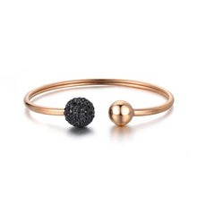 Load image into Gallery viewer, Luxurious bangle bracelet is made of stainless steel and comes in two colours: rose gold and silver. It is richly adorned with two balls. One ball is decorated with cubic zirconia while the other is the same colour as the bangle, rose gold or silver. Cubic zirconia comes in two variants: black and white. This bracelet makes perfect accessory for your evening night out.
