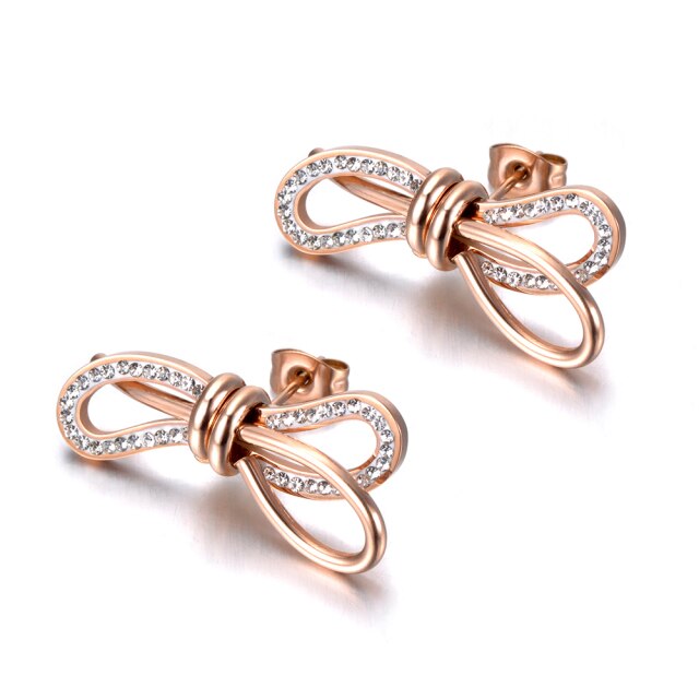 Charming stainless steel earrings are made in a rose gold colour. Earrings are made in a shape of a bow which is adorned with beautiful cubic zirconia. Earrings are rose gold plated and represent elegant and classy accessory for your smart outfit. They have stud fastening.