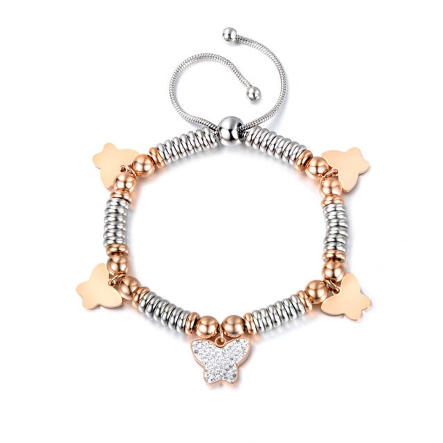 Stainless steel bracelet comes in a combination of two colours: rose gold and silver. It is made of beads in two different colours and additionally adorned with 5 pedants. Pedants come in four shapes: star, heart, butterfly or elephant. Four pedants on a bracelet are smaller in rose gold colour and one is bigger, richly adorned with cubic zirconia. The length is adjustable with a lace up closure.