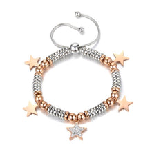 Load image into Gallery viewer, Stainless steel bracelet comes in a combination of two colours: rose gold and silver. It is made of beads in two different colours and additionally adorned with 5 pedants. Pedants come in four shapes: star, heart, butterfly or elephant. Four pedants on a bracelet are smaller in rose gold colour and one is bigger, richly adorned with cubic zirconia. The length is adjustable with a lace up closure.
