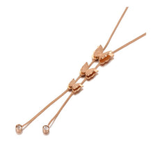 Load image into Gallery viewer, Stainless steel necklace comes in a rose gold colour. It is made of fine thin chain which is adorned with three small pedants in a shape of a butterfly. There are two cubic zirconia attached at the end of each chain as an additional decoration. The necklace is perfect for daily outfits as well as to light up your night dress. It has lobster clasp.
