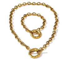 Load image into Gallery viewer, Bracelet is made of stainless steel and comes in a gold colour with real gold plating. It is made of a thick statement chain which is adorned with big toggle clasp at the end. Bracelet is a real statement piece that will glam up your outfit.
