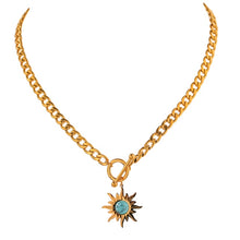 Load image into Gallery viewer, Stainless steel necklace comes in a gold colour and it is three times gold plated. The necklace is made of a thicker link chain which is adorned with a sun pedant and bigger toggle clasp. Sun is adorned with a blue stone that is surrounded with golden rays. This statement necklace is perfect to spice up any outfit. 
