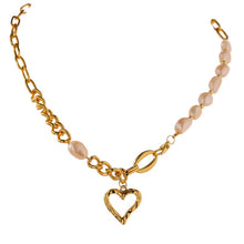 Load image into Gallery viewer, This fashionable necklace comes in a gold colour. It is made of zinc alloy and it is three times gold plated. It is made of big link chain with a combination of pearls. The last link is also a lobster clasp. The necklace is adorned with a hollow heart pedant at its bottom.
