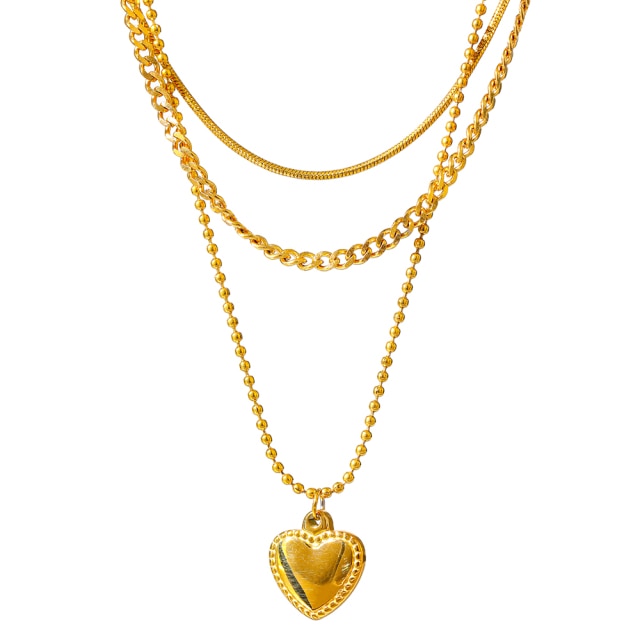 Stainless steel necklace comes in a gold colour and it is three times gold plated. This layered necklace is made of three different chains. The longest one is adorned with a little pedant in a shape of a heart. The heart is decorated with small engraved circles around its border. The chain necklace is perfect for any outfit. It has adjustable length and lobster clasp.