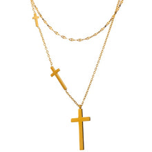 Load image into Gallery viewer, Stainless steel necklace comes in a gold colour and it is three times gold plated. This layered necklace is made of two different, thin and delicate chains with different length. Longer chain is adorned with three crosses in different sizes from which the biggest one is placed at the bottom of the necklace. The chain necklace is perfect for spicing up your daily and evening outfit. It has lobster clasp.
