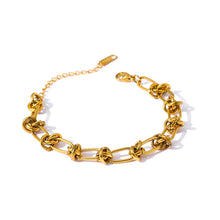 Load image into Gallery viewer, This statement bracelet is made of stainless steel and has real gold plating. It comes in gold colour. Its interesting linked chain makes it perfect accessory for daily and evening outfits. Length is adjustable with lobster clasp.
