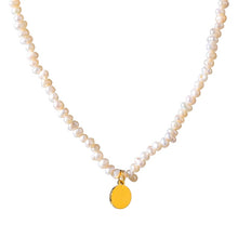 Load image into Gallery viewer, Stylish necklace is handmade of natural pearls in white colour. It is adorned with a little plate in a shape of a circle. The plate is made of stainless steel and comes in gold colour. This necklace is very elegant and it will bring your outfit to a next level. It has adjustable length and lobster clasp. 
