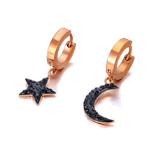 Load image into Gallery viewer, Beautiful stainless steel hoop earrings are made in a rose gold colour. They consists of a little hoop with two different charms: a moon and a star. Both charms are adorned with black cubic zirconia. Earrings are rose gold plated and represent perfect and elegant touch to your daily outfit. They have French lock (hoops).
