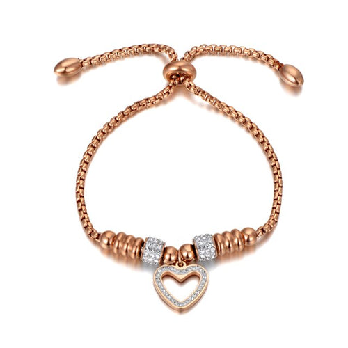 Bracelet is made of stainless steel and comes in two colours: rose gold and silver. It is richly adorned with two rollers and heart charm. Both rollers and heart are decorated with cubic zirconia. The length is adjustable with a small ball. The bracelet is three times rose gold plated.