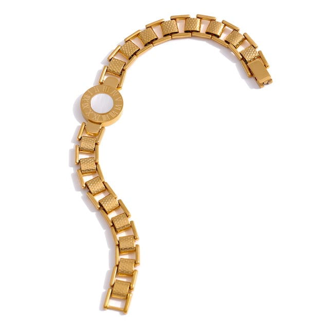 Bracelet is made of stainless steel and has real gold plating. It comes in two colours: gold and silver. It is adorned with a shell plate circled by engraved roman numerals. It has watch clasp and it is a perfect accessory for your smart outfit.