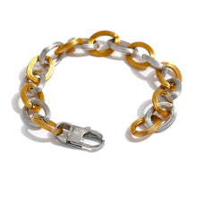 Load image into Gallery viewer, This beautiful bracelet is made of big statement links with notches on its surface. Links come in two colours: gold and silver. Bracelet has lobster clasp and makes perfect statement piece for your statement outfit.
