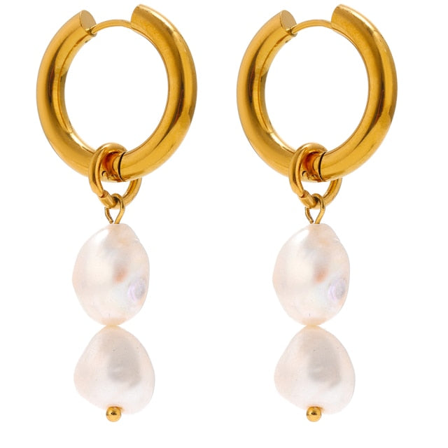 Elegant stainless steel earrings are made in a gold colour. They consists of small hoop on which two natural pearls are hanging. Combination of gold and pearls gives them extra elegant and classy effect. Earrings have real gold plating and represent great accessory to your elegant outfit. They have French lock (hoops).