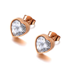 Load image into Gallery viewer, Classy and elegant stainless steel earrings are made in a rose gold and silver colour. The earrings are made in a shape of a heart which is adorned with big cubic zirconia. Earrings are rose gold plated and represent perfect and elegant touch to your classy and smart outfit. They have stud fastening.
