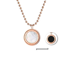 Load image into Gallery viewer, Stainless steel necklace comes in a rose gold and silver colour. It is made of fine beaded chain which is adorned with a statement medallion. Medallion is made of shell and is rotatable. It can be worn on two sides, black and white. The necklace is perfect for daily outfits as well as to light up your night dress. It has lobster clasp.
