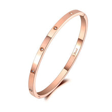 Load image into Gallery viewer, Elegant bangle bracelet is made of stainless steel and comes in four colours: rose gold, gold, black and silver. It is adorned around its perimeter with sparkling cubic zirconia crystals. It is perfect accessory for evening occasions and will sparkle your every outfit.
