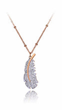 Load image into Gallery viewer, Stainless steel necklace comes in rose gold and silver colour. At the bottom of the necklace there is a charm in a shape of a feather. Feather is adorned with genuine Austrian crystals. Necklace has adjustable length and lobster closure. It is perfect for all occasions. 
