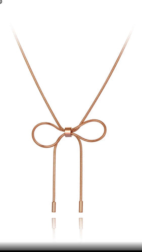 Stainless steel necklace comes in a rose gold colour. It is made of fine thin snake chain which ends with a big bowknot. The necklace is very simple, though makes a perfect accessorize to your outfit. It has lobster clasp.